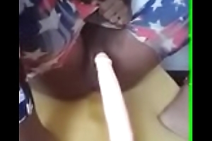 Ebony squirts on fake penis