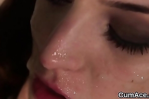 Hot doll gets cumshot surpassing her face swallowing all the charge
